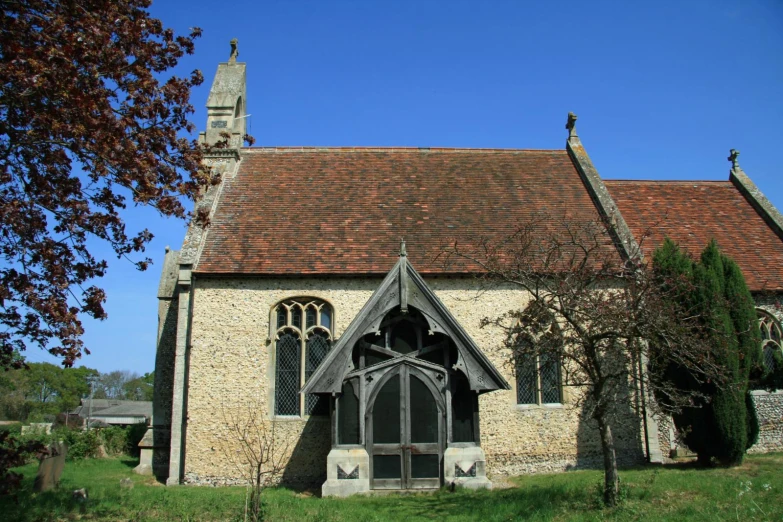 an old church with a pretty tower is pictured