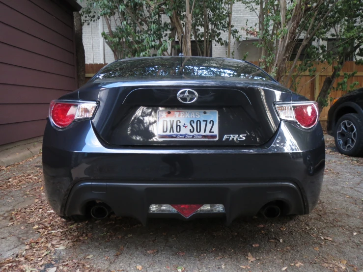 an automobile is parked in front of a house