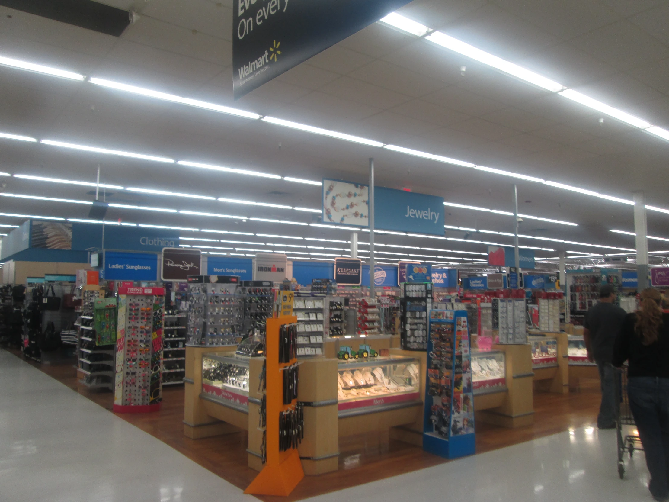 a large room filled with lots of items and people shopping