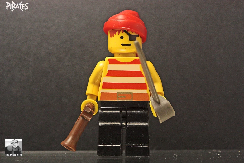 a lego figurine with a rifle and uniform