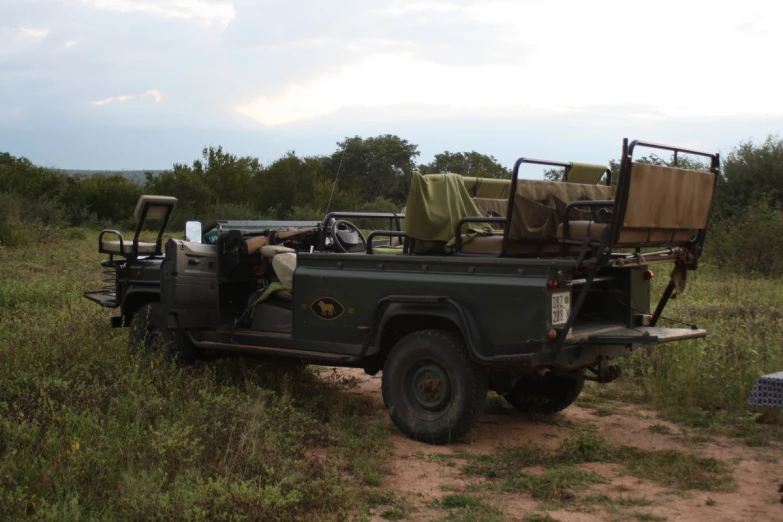 the jeep is loaded with large bags and items