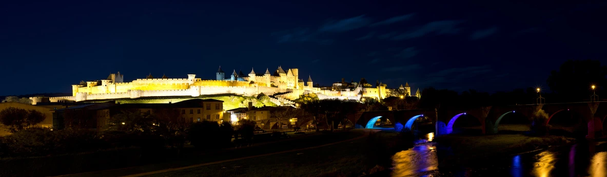 a large castle sits on top of a hill