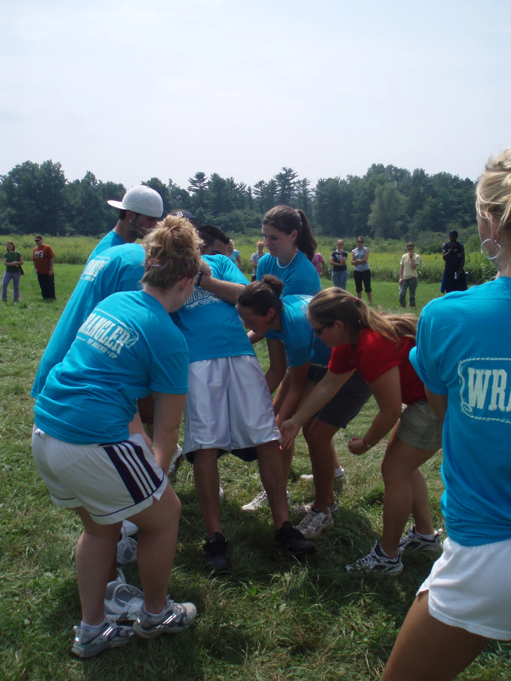 there are several women standing together in a group