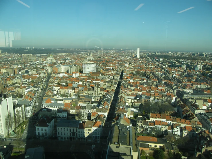 a city is seen from an airplane over buildings