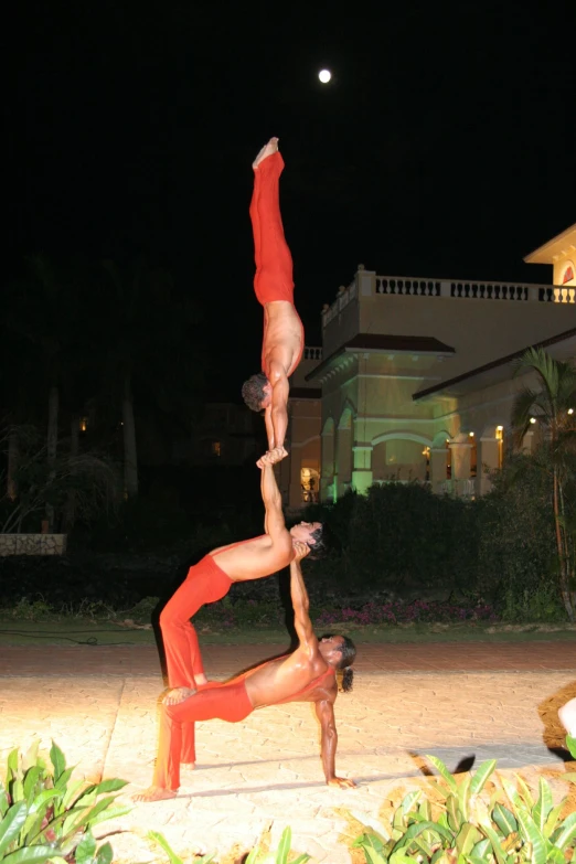 two young people who are in the air with their hands over one another