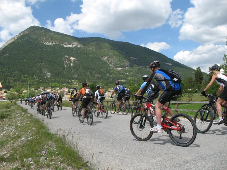 a bunch of bikers are going up the hill