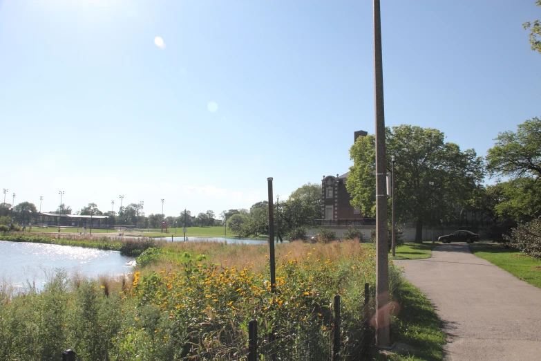 a street sign and signs by the water