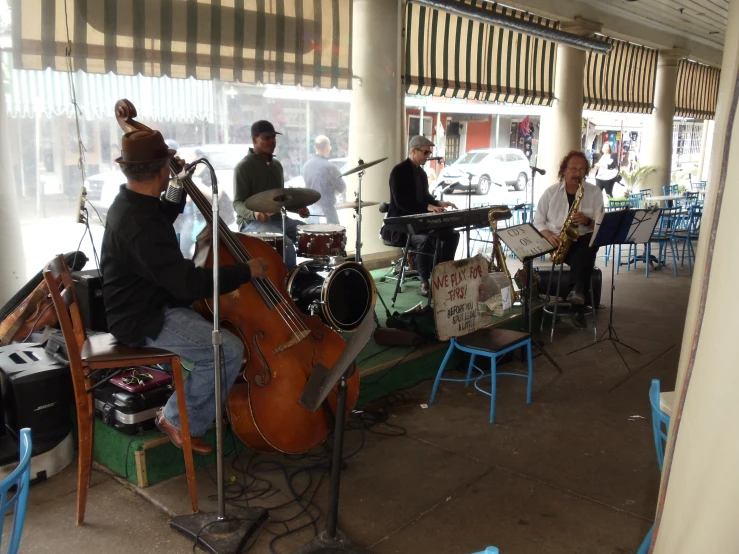 several people playing musical instruments in a restaurant