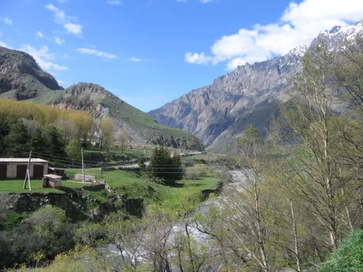 a stream in the middle of a mountainous area