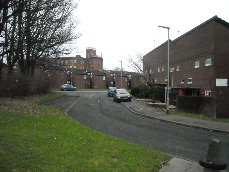 cars are parked at an empty and secluded road