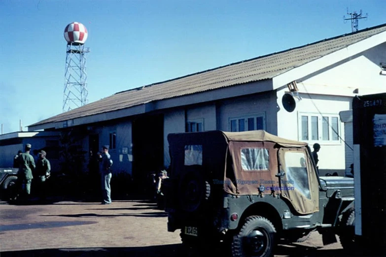 a small car parked outside of a building