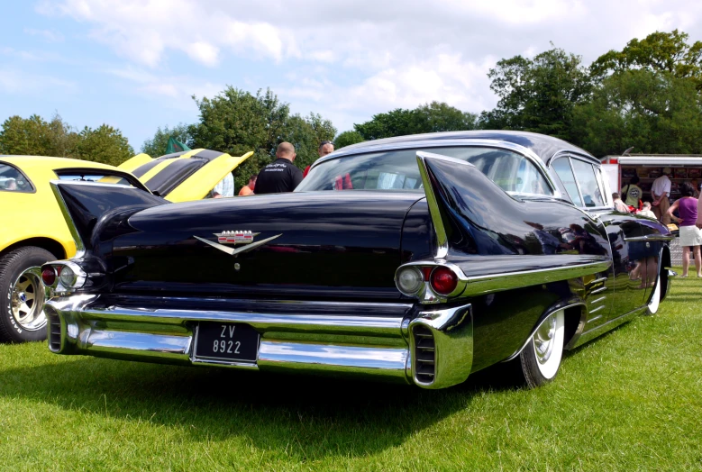 antique cars parked next to each other on display