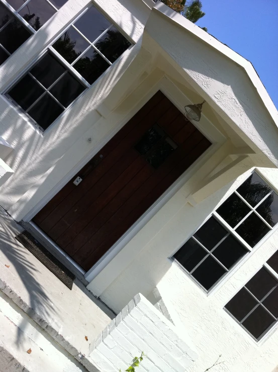 this is an image of a white building with black windows