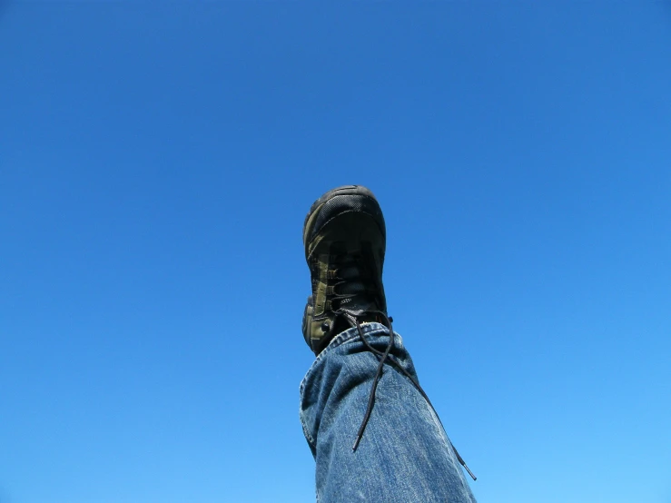 a person with their shoes in the sky