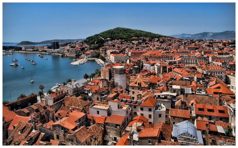 a view of the buildings of a large city and bay