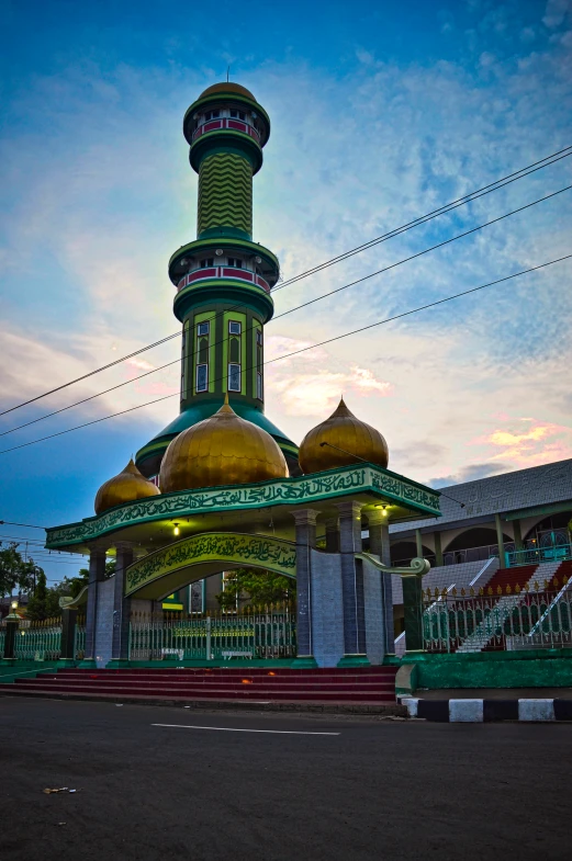 a building with some domes on it near other buildings