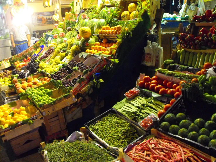 fruit and vegetable display in a store with prices