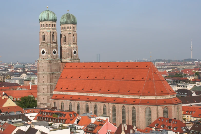 the rooftop of a church is covered in red roofs