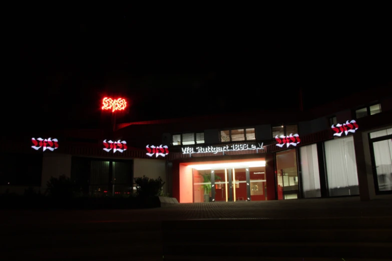 lit up building with lit up sign and decorations