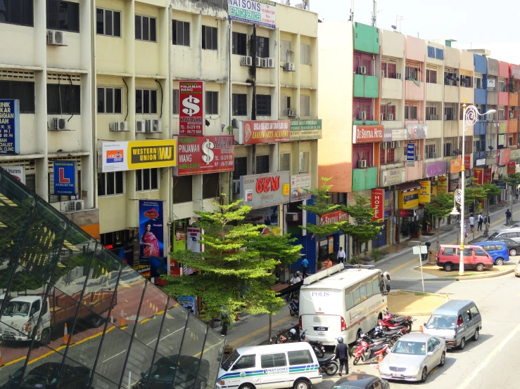 a city street lined with lots of cars parked on both sides