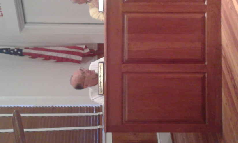 two men in the judges'booth at a courtroom