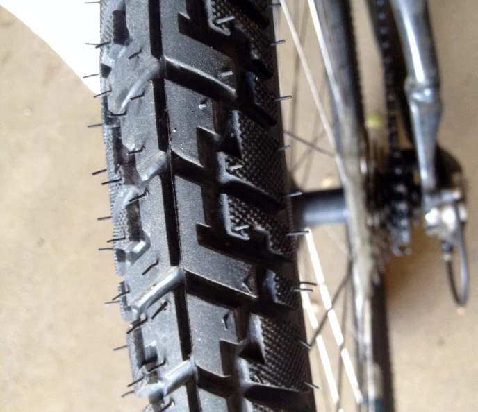 a close up po of a bike tire with no spokes