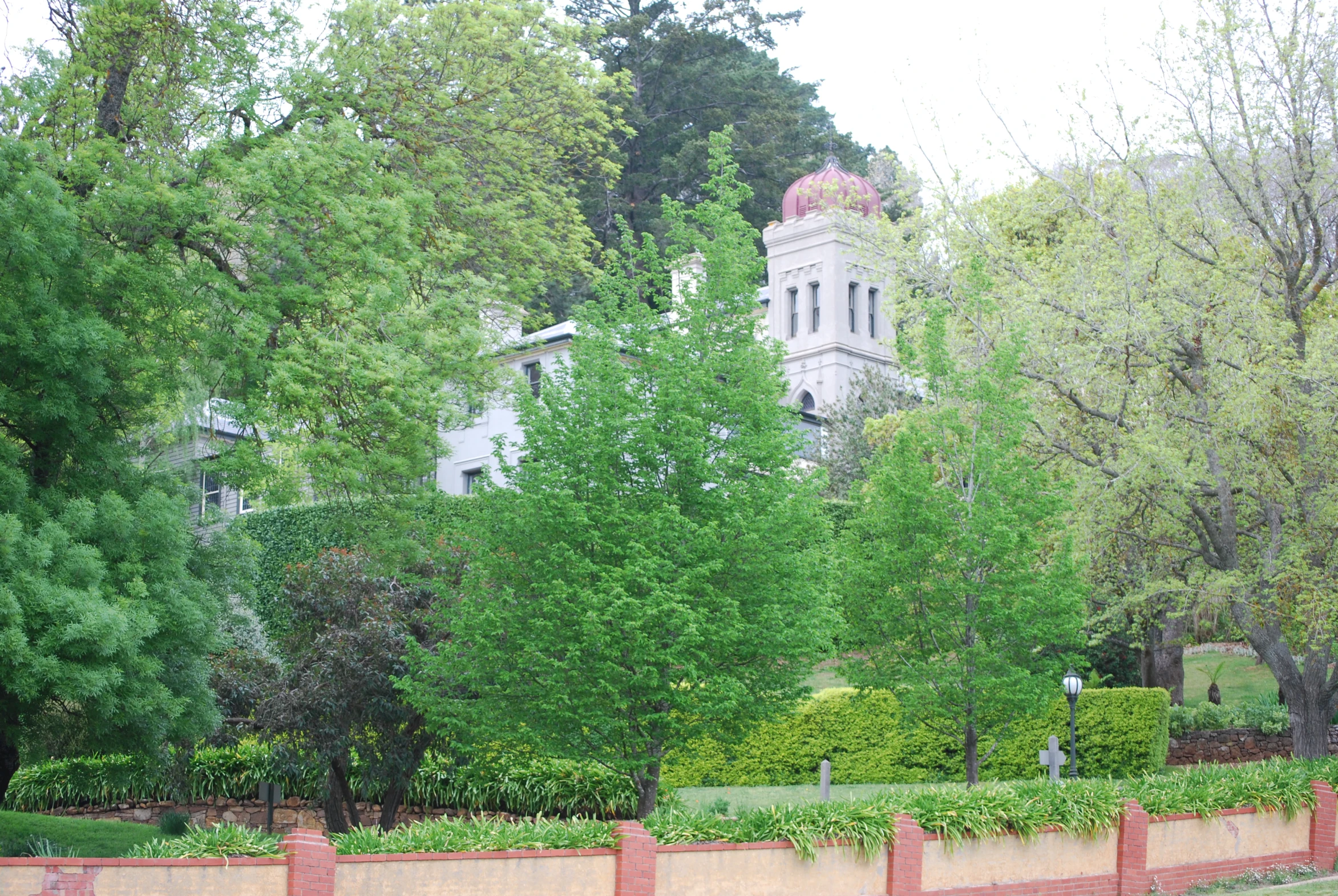 an image of a big building in the trees