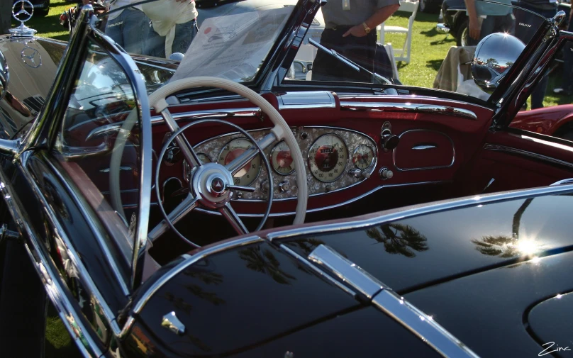 an old car is seen during an outdoor car show