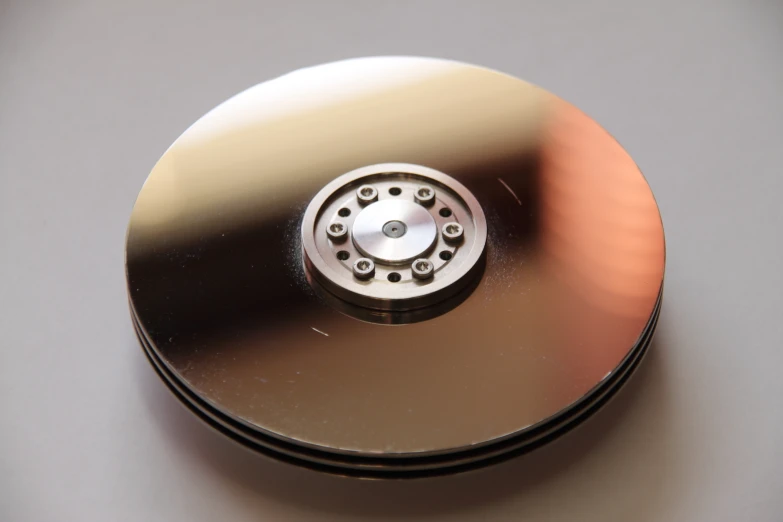 a compact disk that has some gold discs