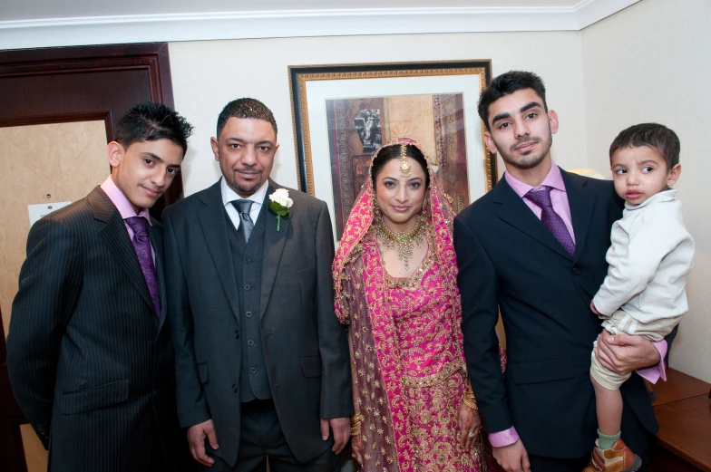 a family posing for a po together at a reception