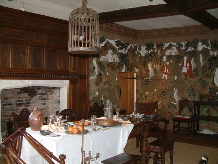 a dining room with wood paneled walls and decorated with paper decorations