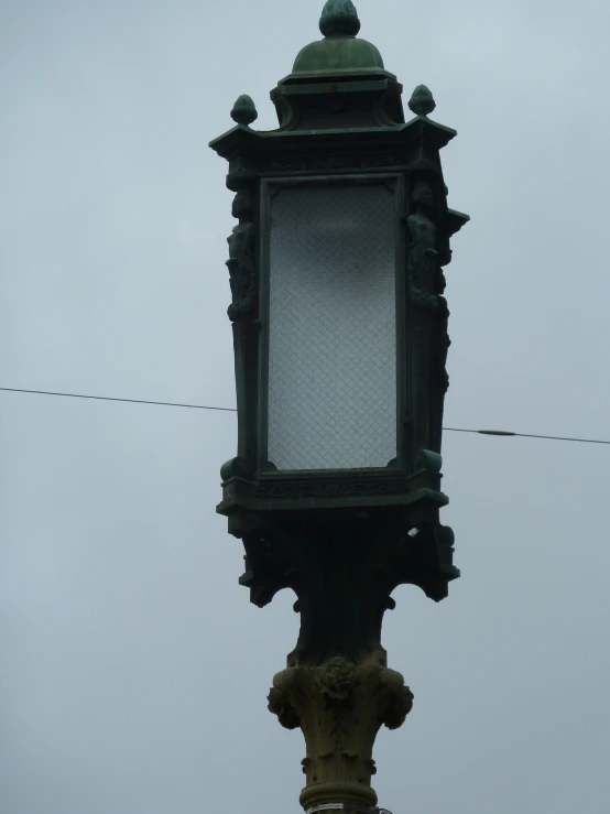 a large metal street light on top of a pole