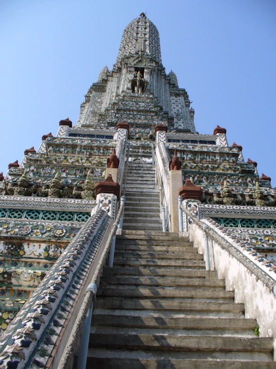 a staircase leads up to an ornately decorated steeple