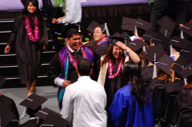 the graduates are celeting at a graduation