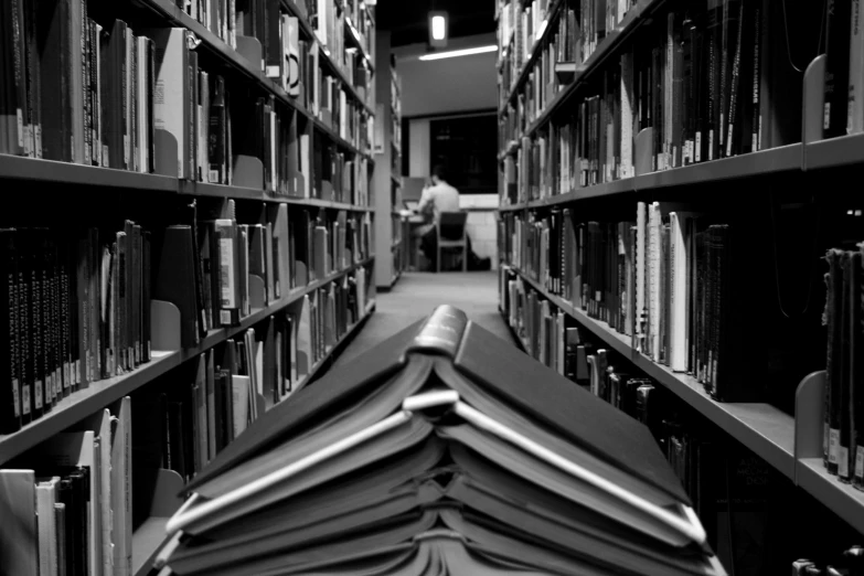 a group of books that are inside of a bookcase