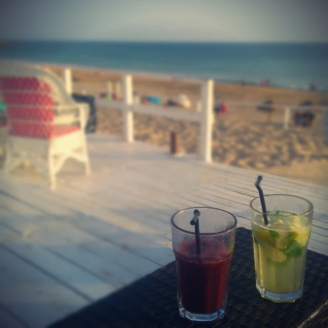 two beverages sitting next to each other on top of a table