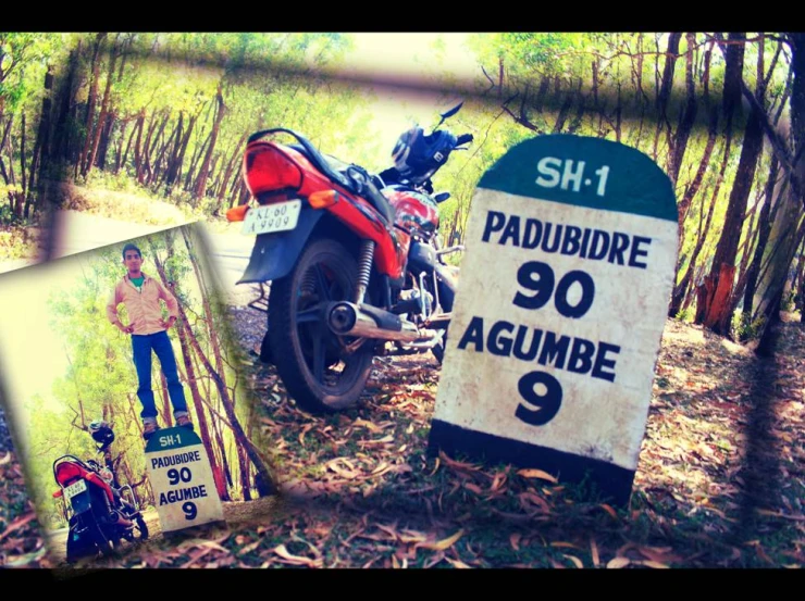 two signs and a motorcycle parked on the side of the road