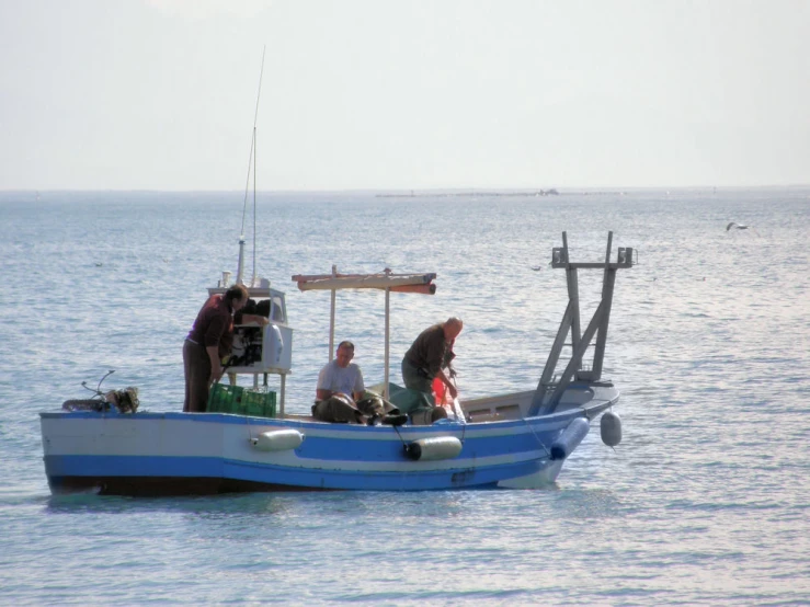 two people on the front of a boat that has been pulled in the water