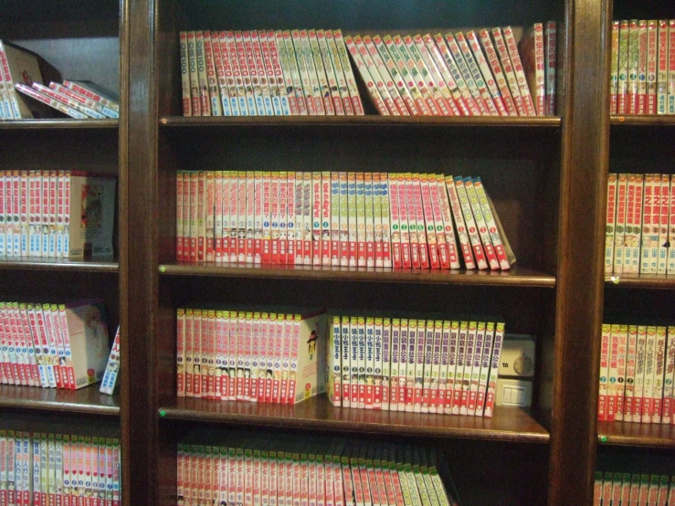 a bookshelf full of books on wooden shelves