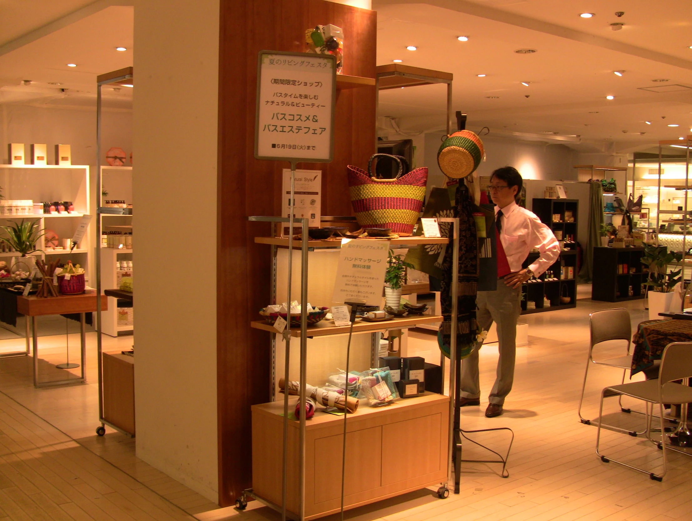 a person standing behind a counter inside of a store