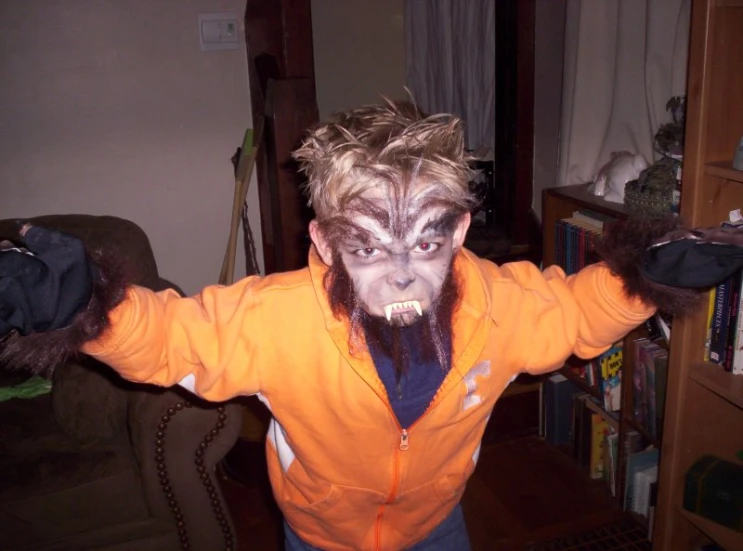 a person wearing scary makeup and wearing an orange jacket