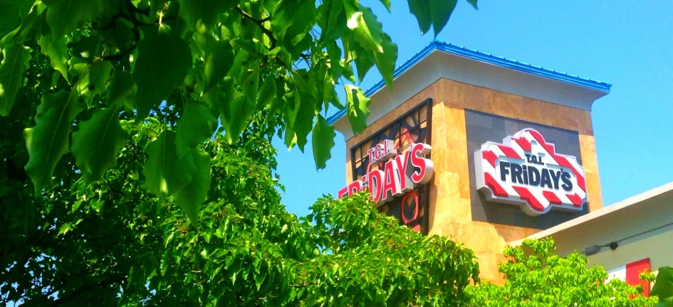 the outside of a deli with its signage displayed