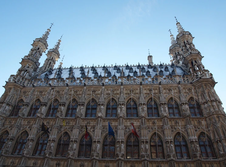 a large building with steeples and clocks