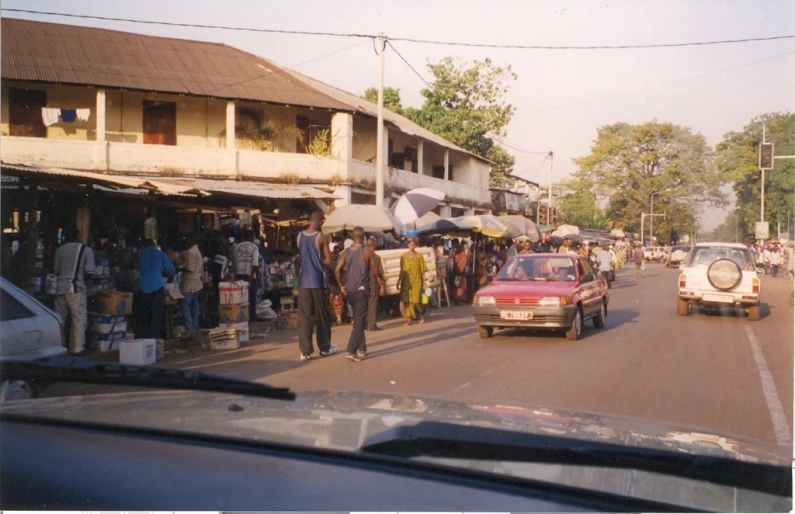 the view of people and cars on a city street