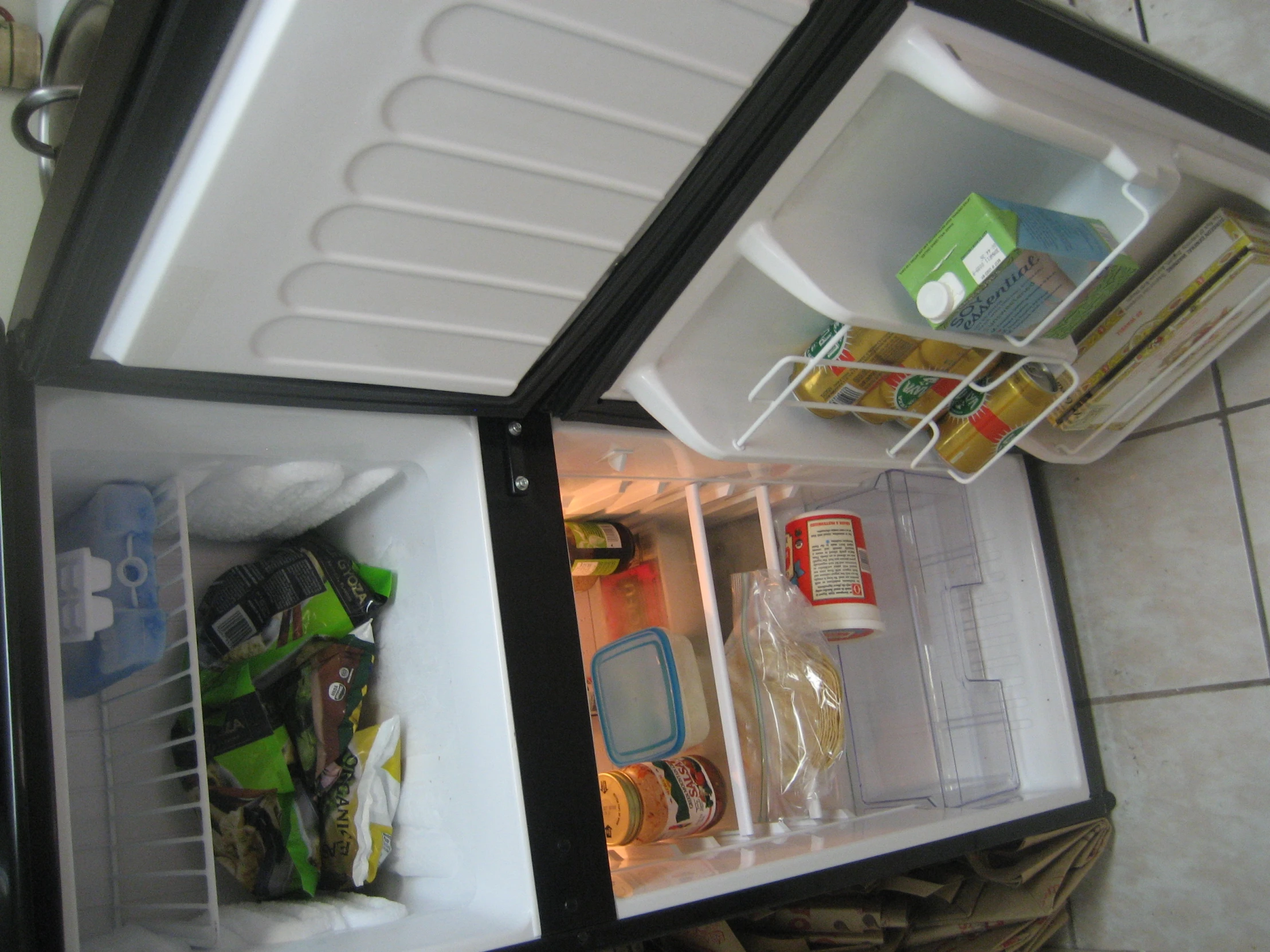 an open refrigerator with food and drinks