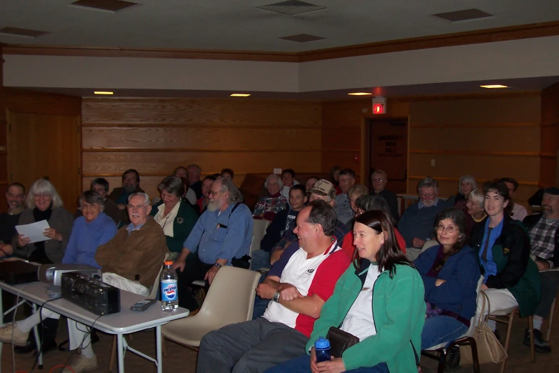 a room full of people watching soing or being there