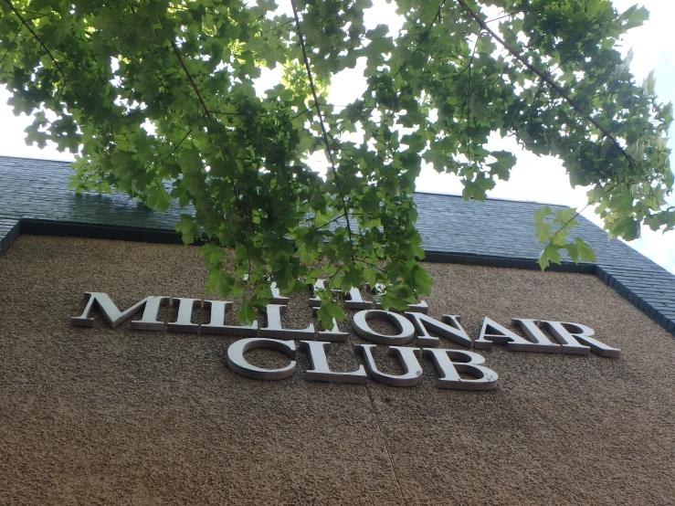 the sign on the building reads the millo air club