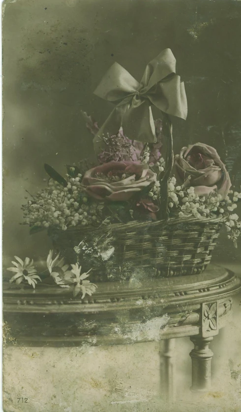 a basket filled with lots of different flowers