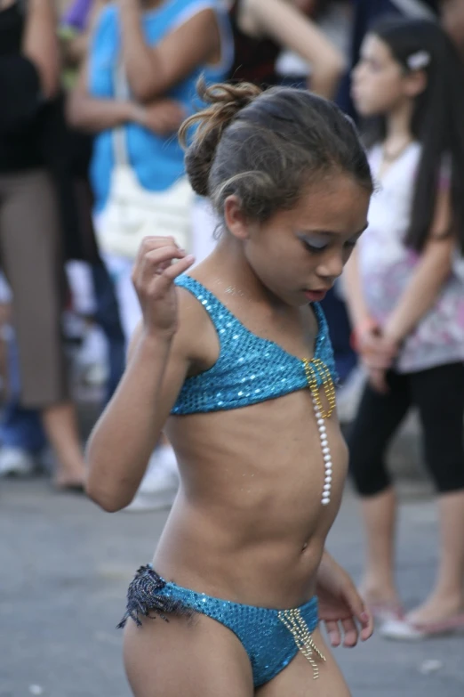 a very cute girl wearing a bikini with beads on it