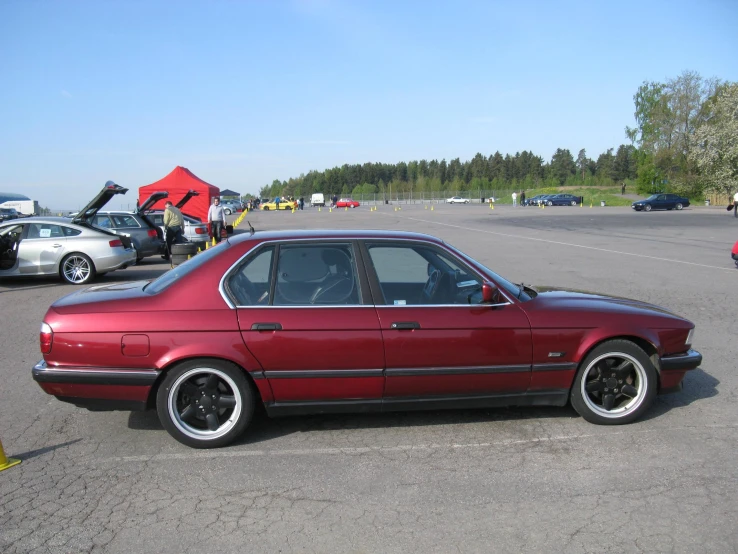 red bmw car in an empty parking lot